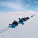 The SALSA Traverse—a caravan of tractors towing drilling and camp equipment—on its 650-mile (1,046-kilometer) journey to Lake Mercer.